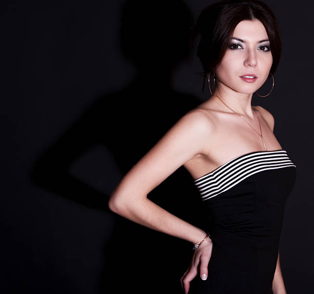 Beautiful young woman portrait on dark background