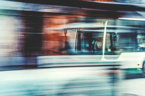 istock Long exposure of moving and waiting buses 971751030