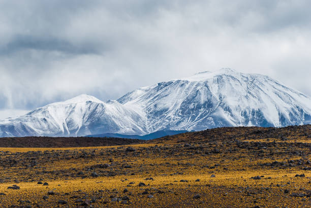 Storm clouds over Volcano Incahuasi, on the border of the Argentine province of Catamarca, and the Atacama Region of Chile. Incahuasi has a summit elevation of 6,621 metres (21,722 ft) above sea level. View from Route 60.