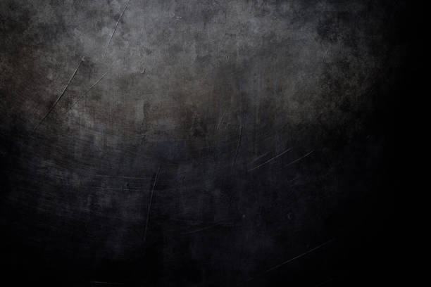 istock dark grungy background with spotlight background 971785378