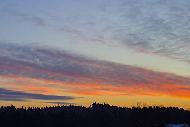 istock Sunset in winter with afterglow over a forest 971809868