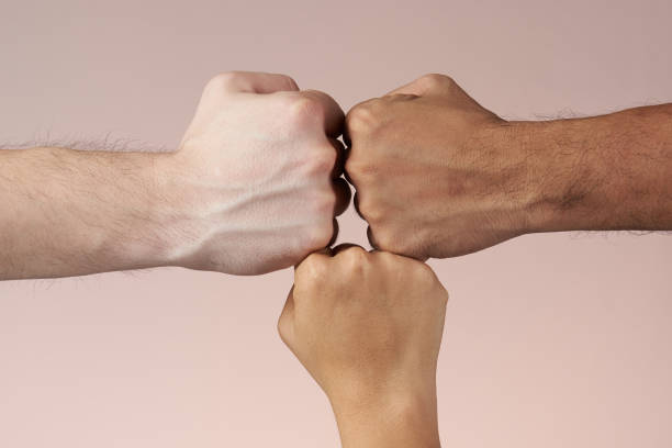 istock Hands fists together 971819728