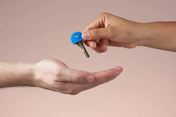 istock One hand give house key 971819752