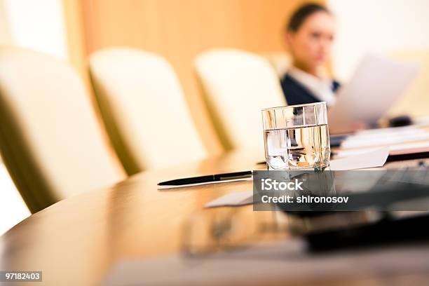 Close Up Of A Glass Of Water On A Conference Table Stock Photo - Download Image Now - Arranging, Black Color, Board Room