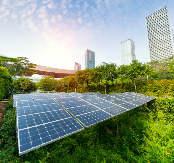 istock solar panel plant with urban landscape landmarks,Ecological energy renewable concept. 971843912