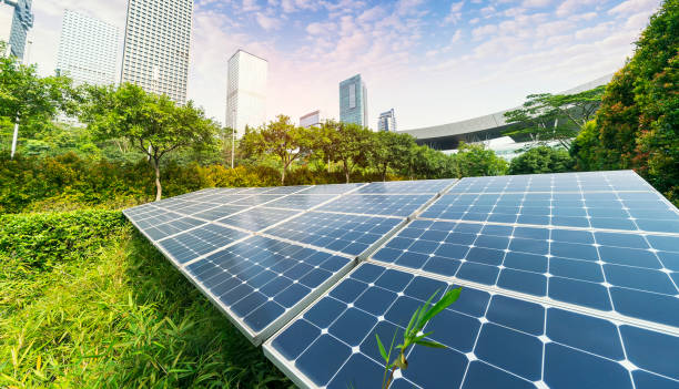 istock solar panel plant with urban landscape landmarks,Ecological energy renewable concept. 971843956