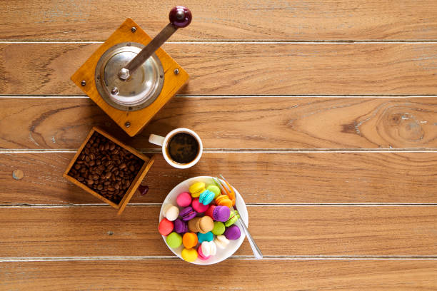 istock Morning coffee on wooden with macarons biscuit 971846038