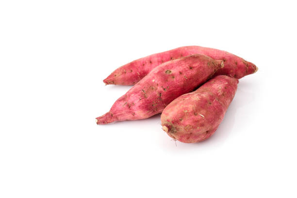 istock Sweet potatoes isolated on white background 971846332