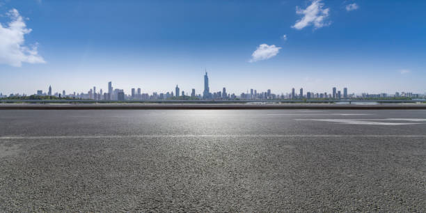 istock Panoramic skyline and modern business office buildings with empty road,empty concrete square floor 971858520