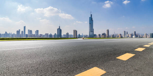 istock Panoramic skyline and modern business office buildings with empty road,empty concrete square floor 971898412