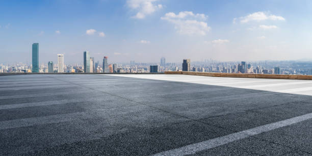 istock Panoramic skyline and modern business office buildings with empty road,empty concrete square floor 971910294