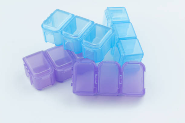 istock Blue and purple empty pill / medication / tablet box on isolated white background 971914996