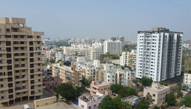 Growing cities in India Concrete buildings showing growing cities in Asian developing countries pune photos stock pictures, royalty-free photos & images