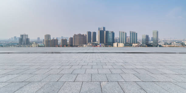 istock Panoramic skyline and modern business office buildings with empty road,empty concrete square floor 971919492