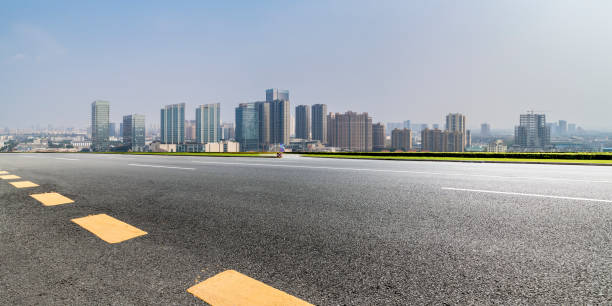 istock Panoramic skyline and modern business office buildings with empty road,empty concrete square floor 971919514
