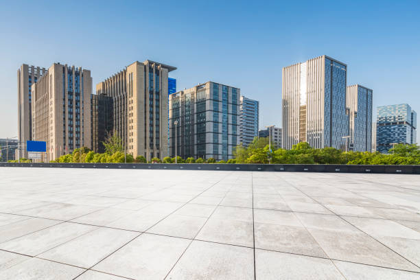 istock Panoramic skyline and modern business office buildings with empty road,empty concrete square floor 971924466
