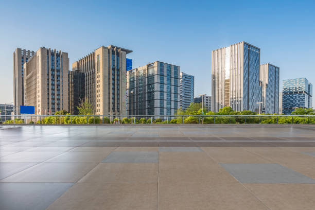 istock Panoramic skyline and modern business office buildings with empty road,empty concrete square floor 971924542