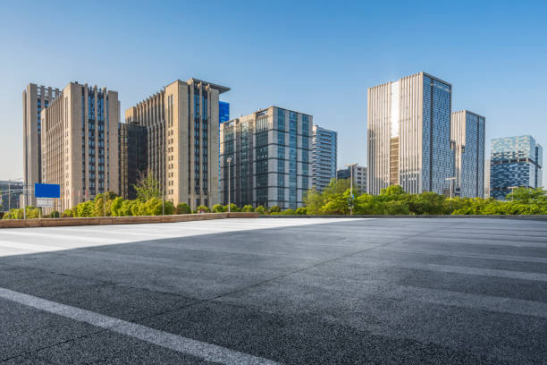 istock Panoramic skyline and modern business office buildings with empty road,empty concrete square floor 971924544
