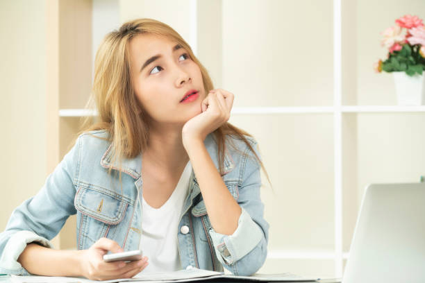 istock Creative woman thinking or planning in the office. 971942858