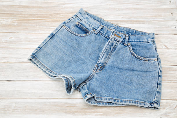 Old Short Denim on rustic white wooden Table