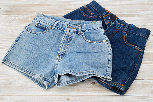 Old Short Denim on rustic white wooden Table