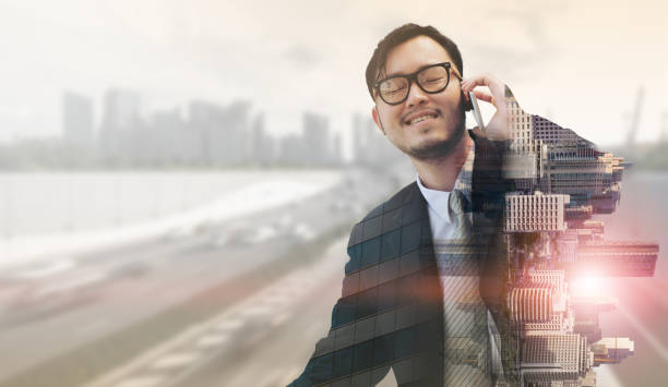 istock Double exposure businessman using mobile phone. 971949488