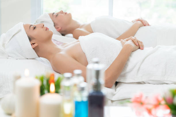 istock Relaxed young woman lying on spa bed for massage. 971952742
