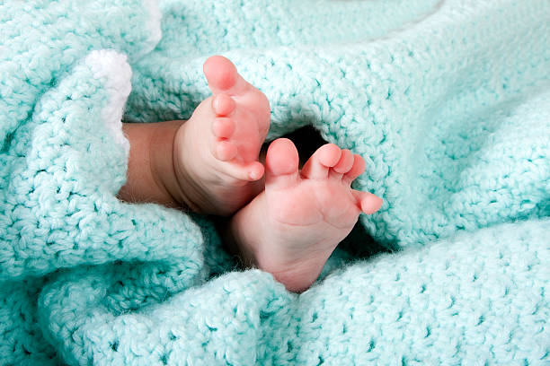 istock Baby feet in blanket 97195719