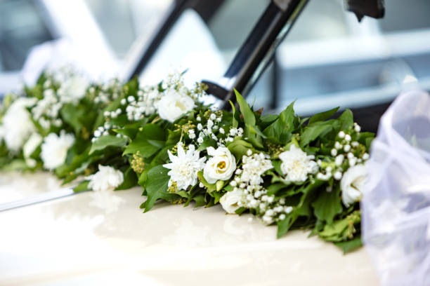 calla lily luxury bouquet , wrapped with elegance caried by a bride in the back of the car seat
