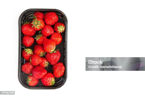 Ripe Strawberry In Black Container On White Background Stock Photo - Download Image Now