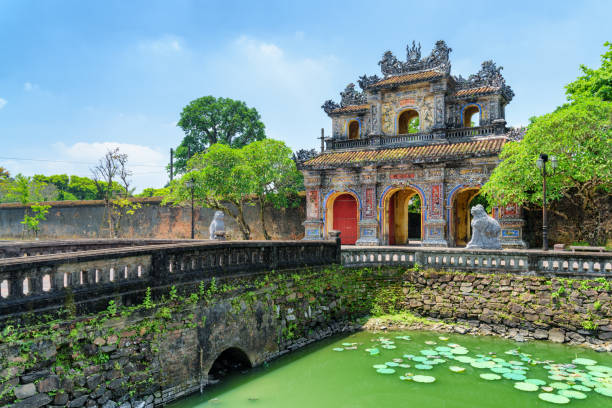 Wonderful view of the East Gate (Hien Nhon Gate), Hue Wonderful view of the East Gate (Hien Nhon Gate) to the Citadel and a moat surrounding the Imperial City with the Purple Forbidden City in Hue, Vietnam. Hue is a popular tourist destination of Asia. vietnam stock pictures, royalty-free photos & images