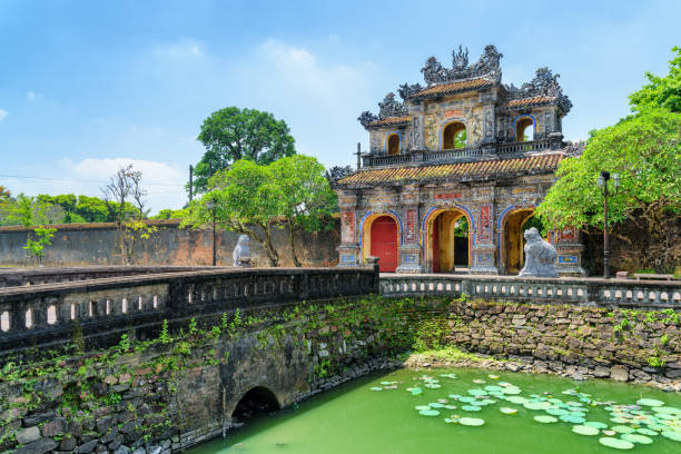 Wonderful view of the East Gate (Hien Nhon Gate), Hue Wonderful view of the East Gate (Hien Nhon Gate) to the Citadel and a moat surrounding the Imperial City with the Purple Forbidden City in Hue, Vietnam. Hue is a popular tourist destination of Asia. central vietnam stock pictures, royalty-free photos & images