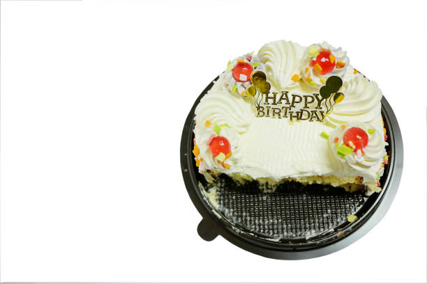 istock Half eaten Birthday cake on a black plate isolated on white background. Copy space 971969794