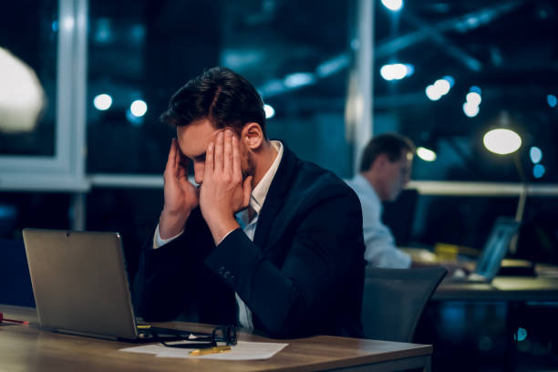 istock Young businessman staying up late working 971972558