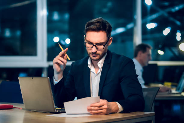 istock Young businessman staying up late working 971972598