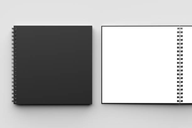 istock Spiral binder square notebook mock up with black cover isolated on soft gray background. 3D illustration. 971972694
