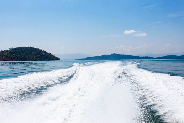 istock View behind the speed boat with sea and wave 971973004
