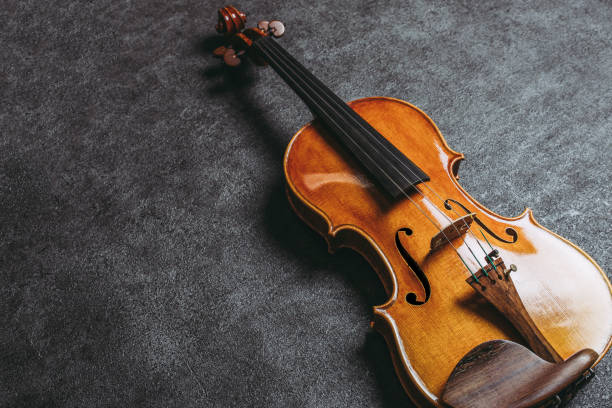 istock Violin and black background 971980998