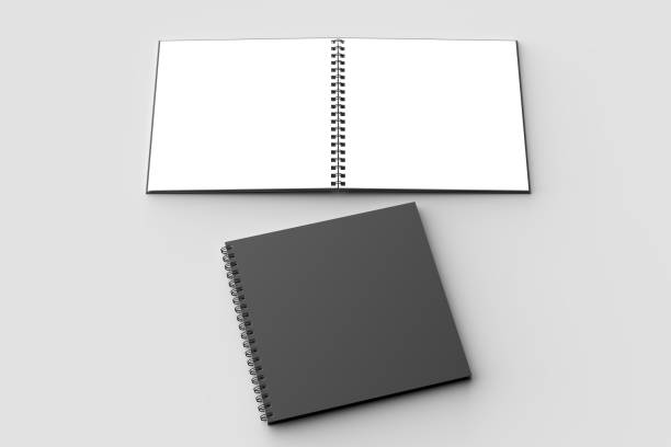 istock Spiral binder square notebook mock up with black cover isolated on soft gray background. 3D illustration. 971983794