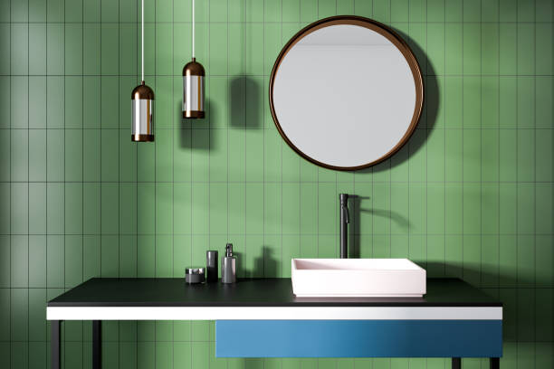 istock Bathroom sink, green walls and mirror 971987102