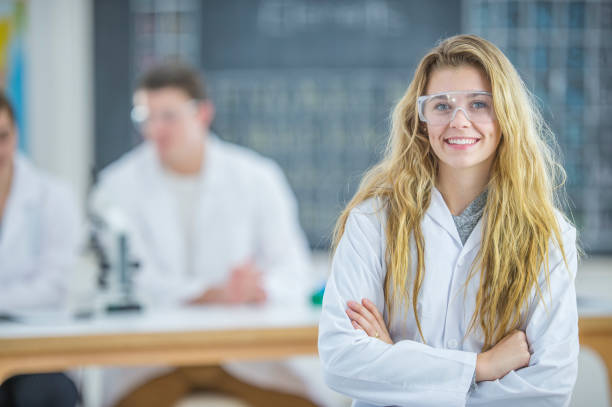 istock Happy Woman In Science Class 971992676