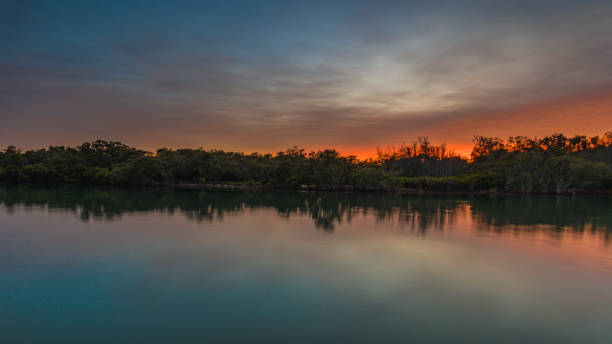 istock Waterscape Sunrise and Silhouettes on the Bay 972001212