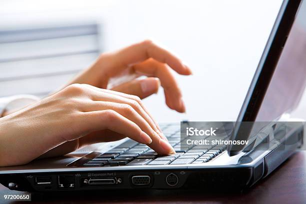 Closeup Of A Females Hands Typing On A Laptop Keyboard Stock Photo - Download Image Now