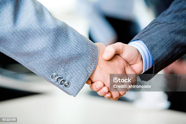 Two Businessmen Engaging In A Handshake Stock Photo - Download Image Now - Adult, Agreement, Business