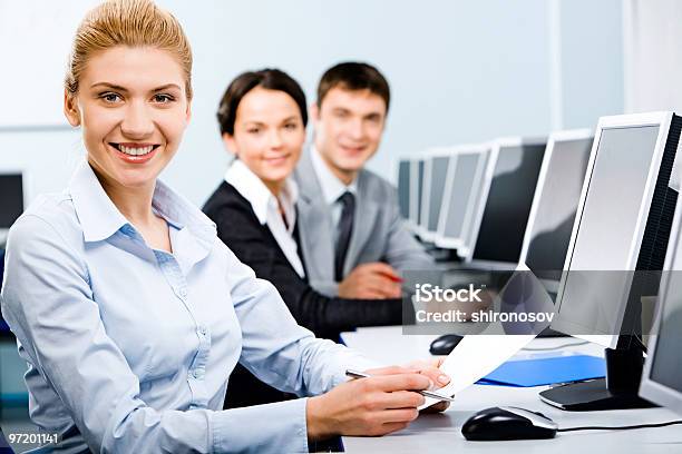 Students Learning By Using The Computer Stock Photo - Download Image Now - Achievement, Adult, Adults Only