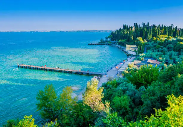 Scenic view of Sirmione beach, a charming little town located on the shores of Lake Garda, nothern Italy