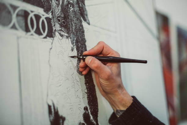 istock close up hand is drawing picture 972016080
