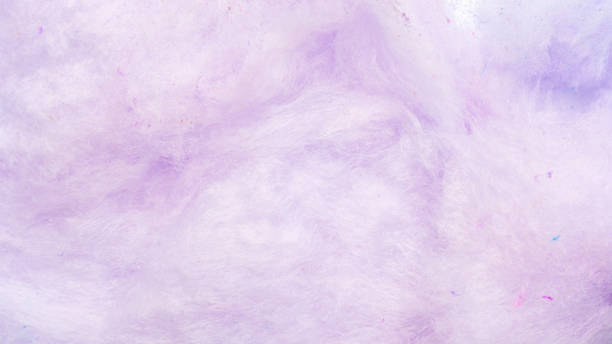 Close up of purple cotton candy for a background. Close up of purple cotton candy for a background. candyfloss stock pictures, royalty-free photos & images