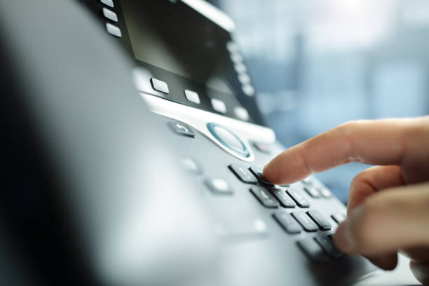 istock Dialing a telephone in the office 972029248