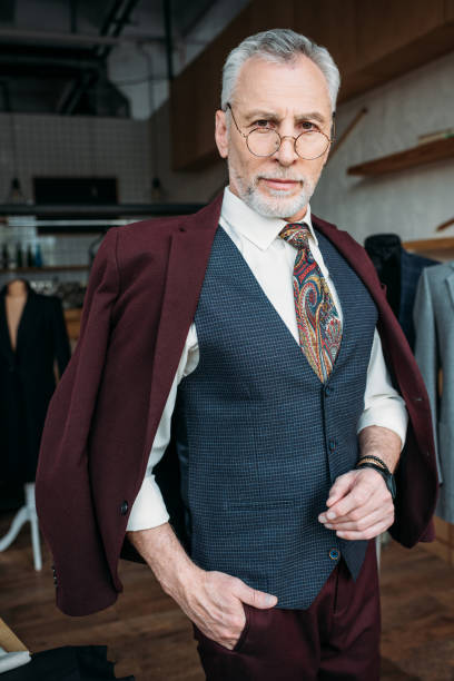 istock serious mature man in stylish clothes looking at camera 972032276